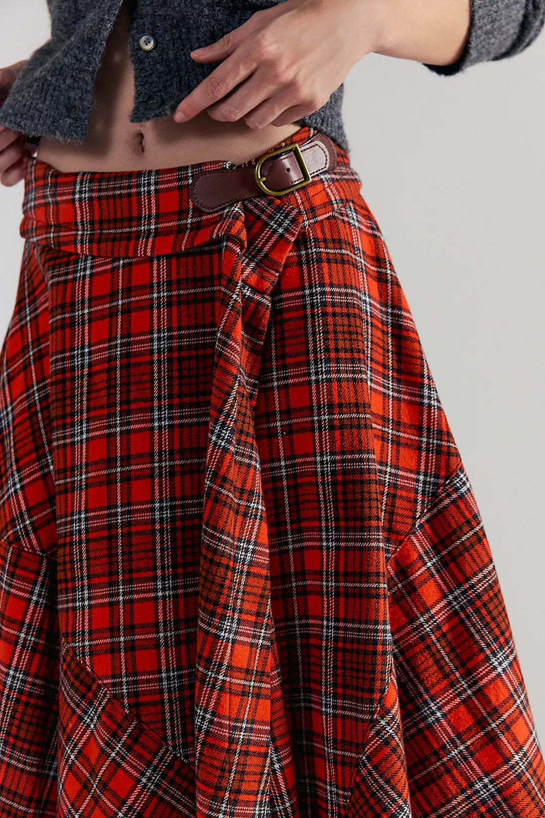 Free People Red plaid skirt worn by a person on a gray background