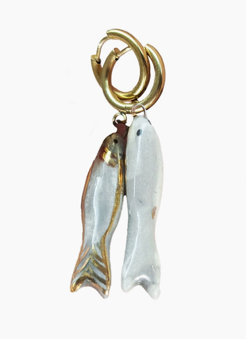 Fish-shaped charms on a white background