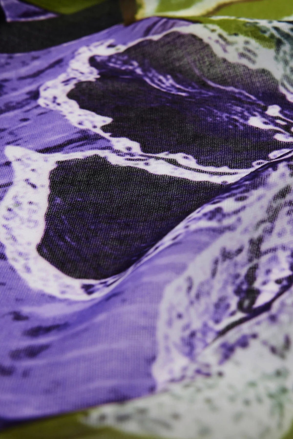 Close-up of a purple fabric with lace detailing
