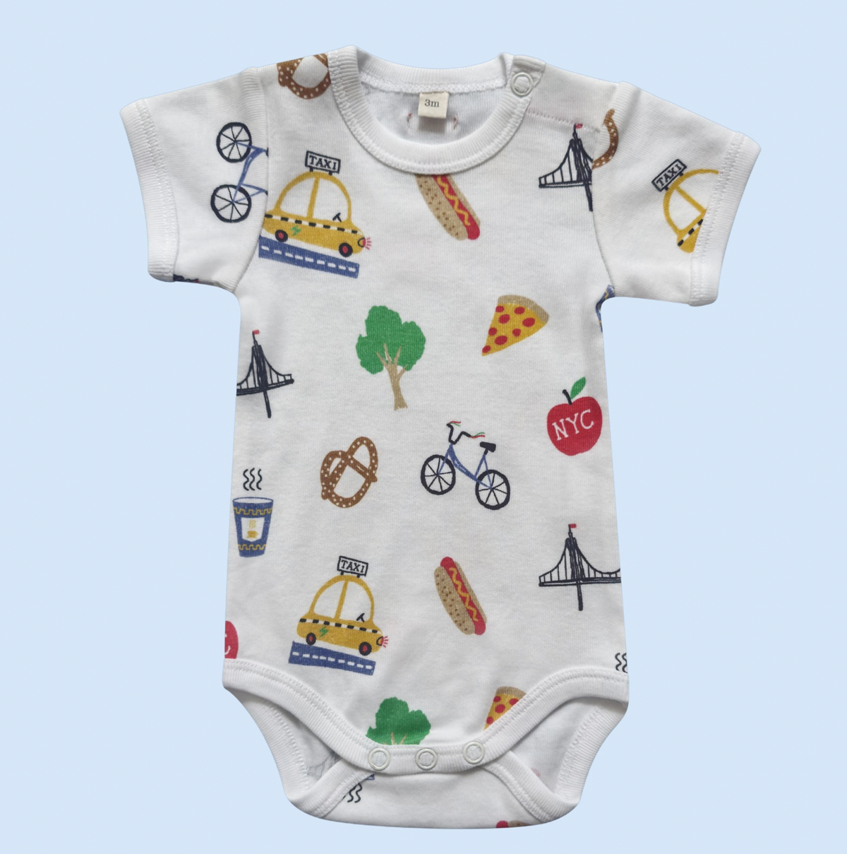 Baby onesie with colorful NY graphics, including taxis, bikes, and hot dogs. 
