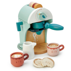 Toy coffee machine with cups and a bird design on a white background