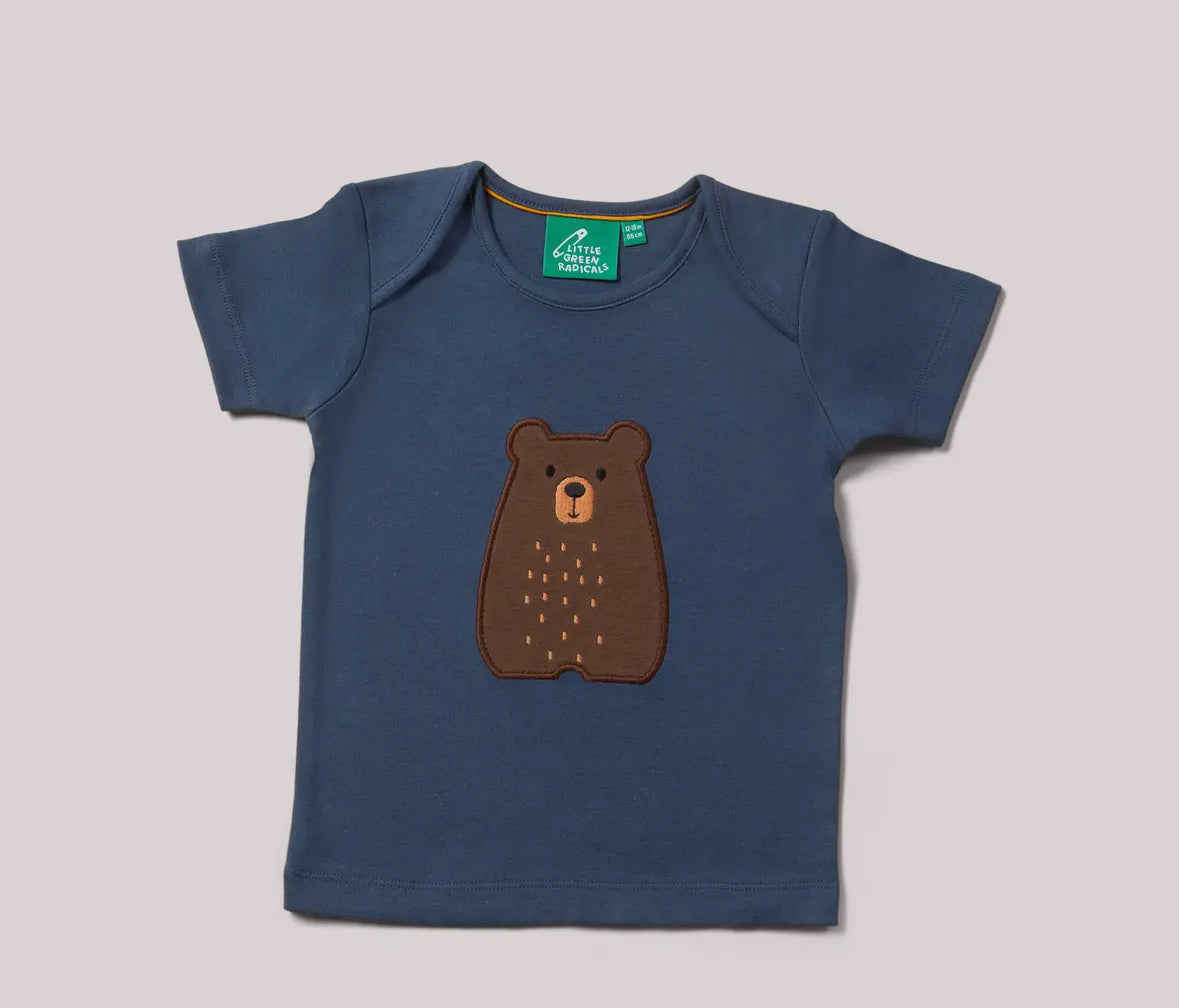 Blue t-shirt with a brown bear design on a gray background