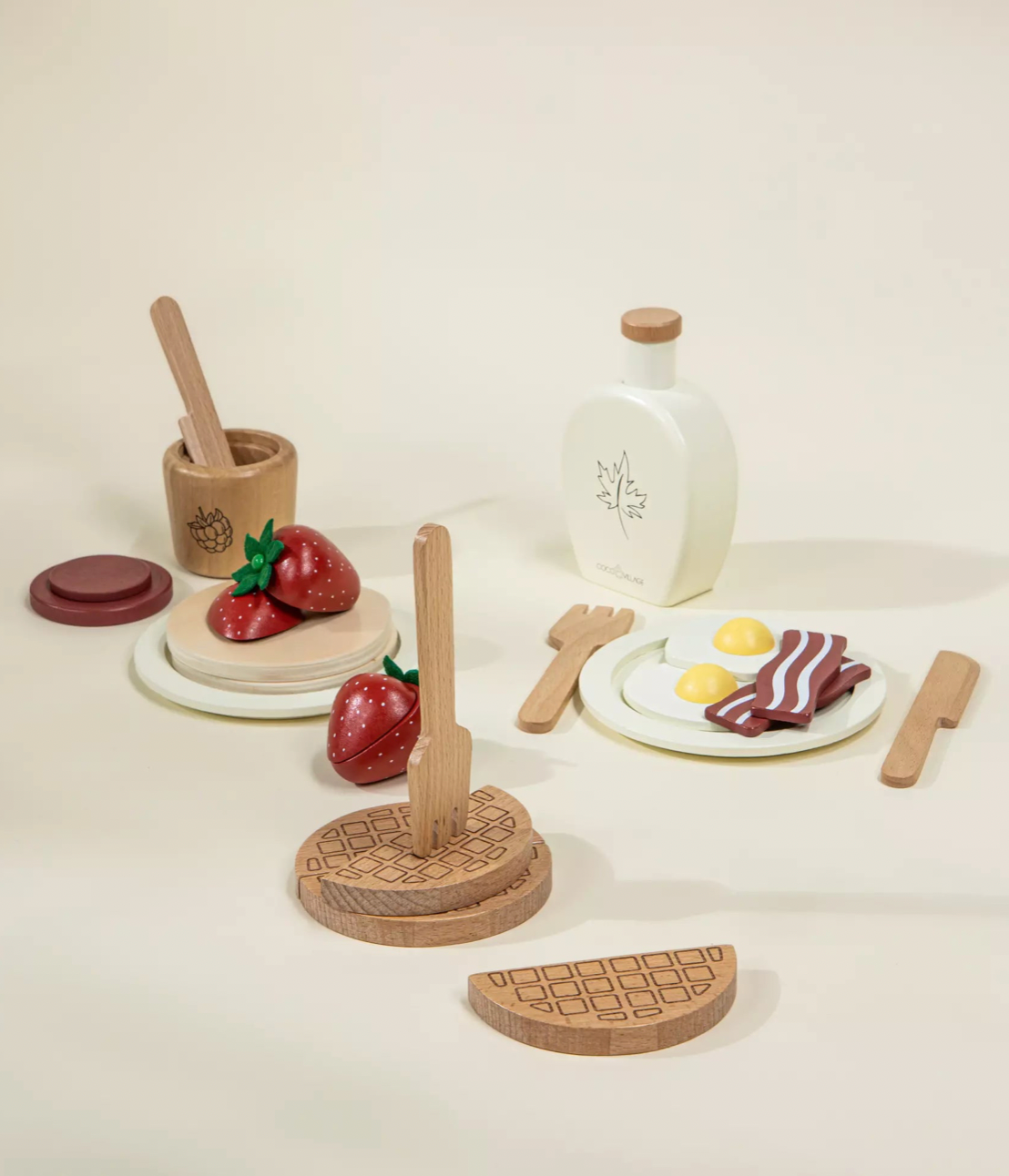 Wooden toy food set on a white surface