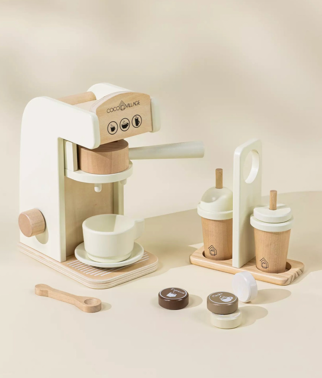 Wooden coffee maker set with cups and accessories on a beige background