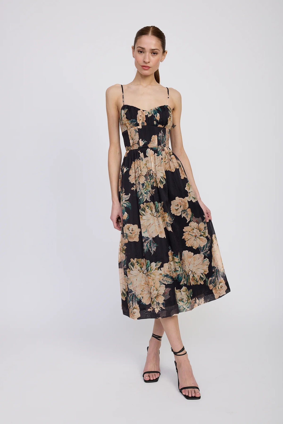 Woman wearing a floral dress on a white background