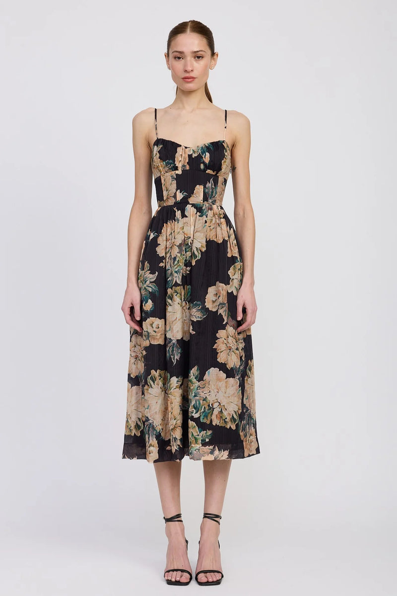 Woman wearing a floral dress on a white background