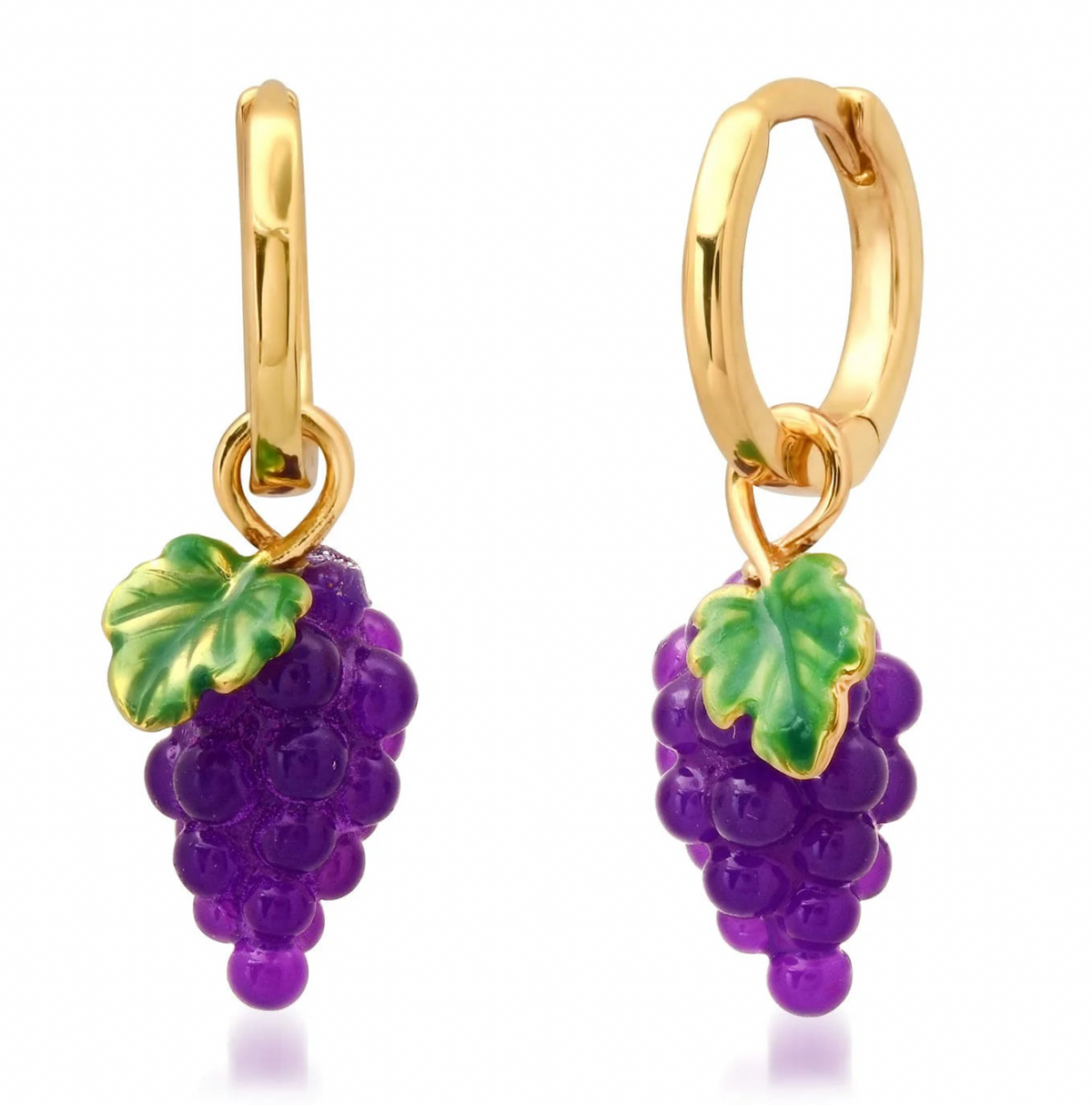 Gold hoop earrings with purple grape clusters and green leaves on a white background