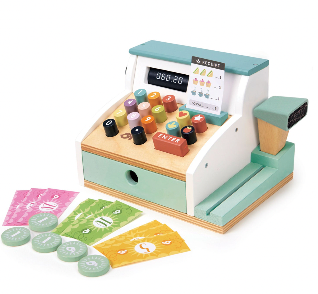 Toy cash register with stamps and receipts on a white background