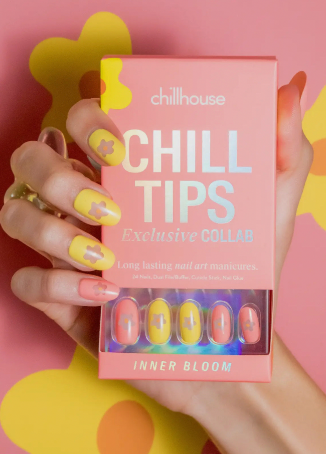 Chillhouse Chill Tips nail art collection with a hand holding the packaging against a pink background.