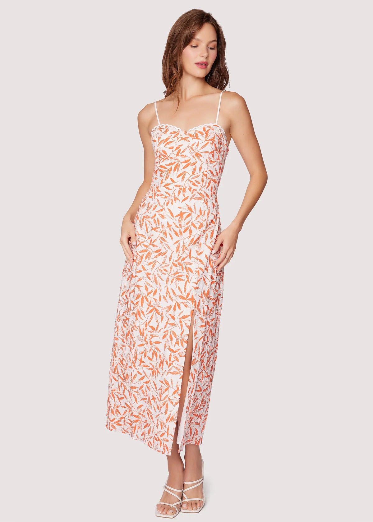 Woman wearing a floral dress on a white background