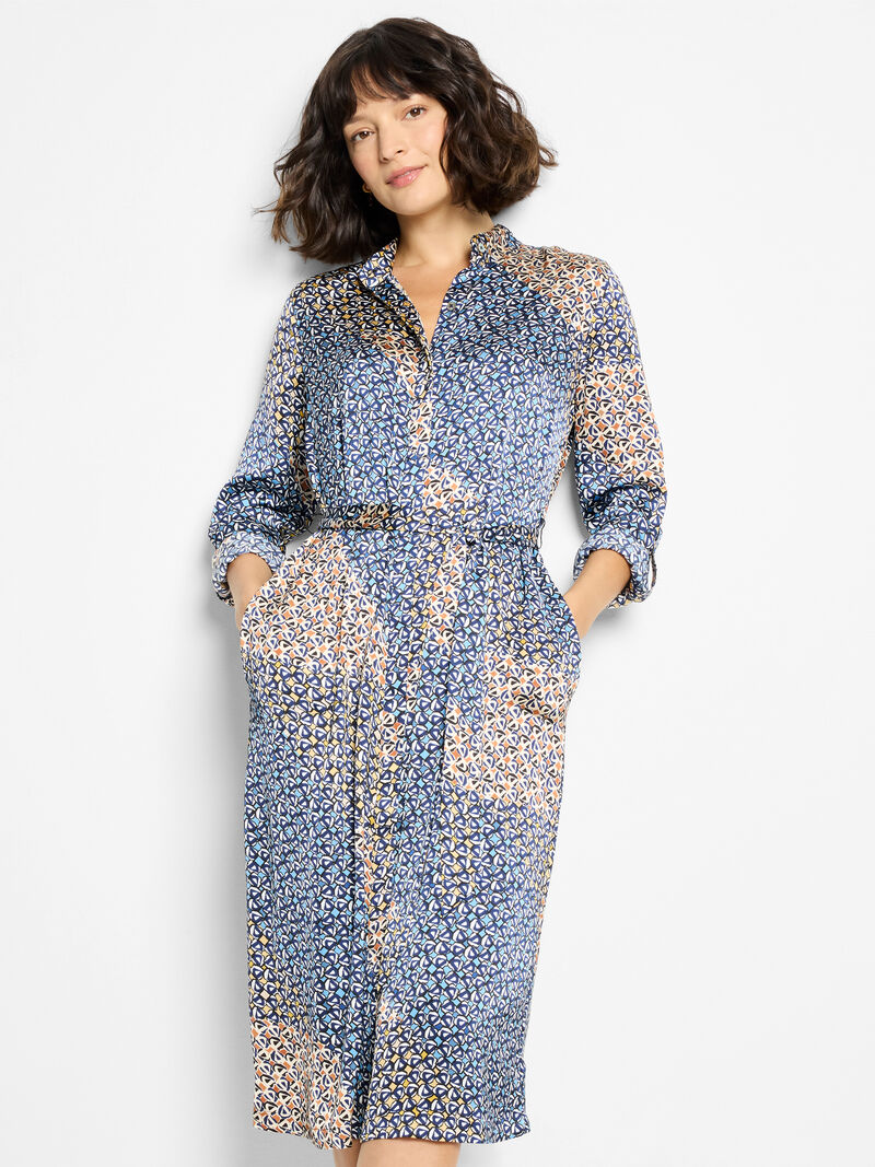 Woman wearing a blue floral dress on a white background