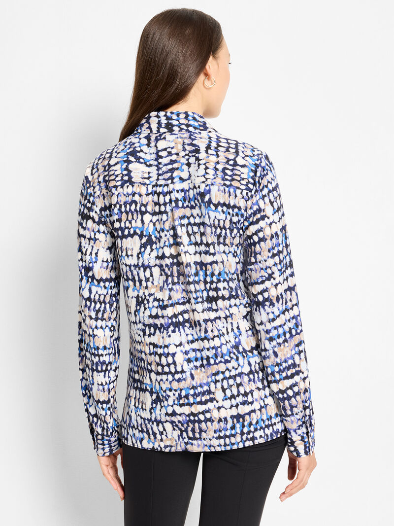 Woman wearing a patterned long-sleeve shirt 