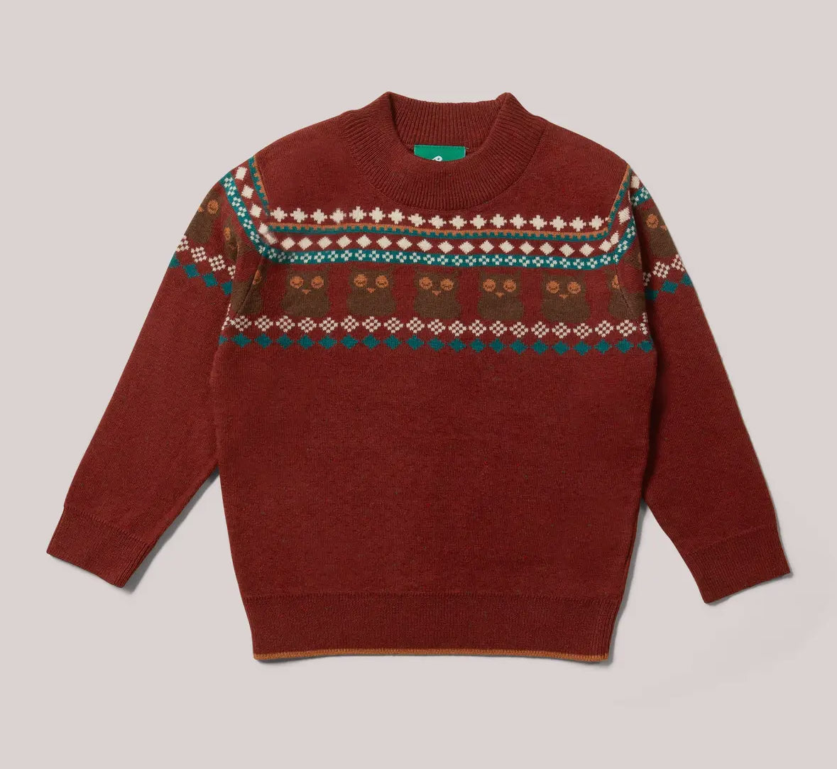 Red sweater with patterned design on a light gray background