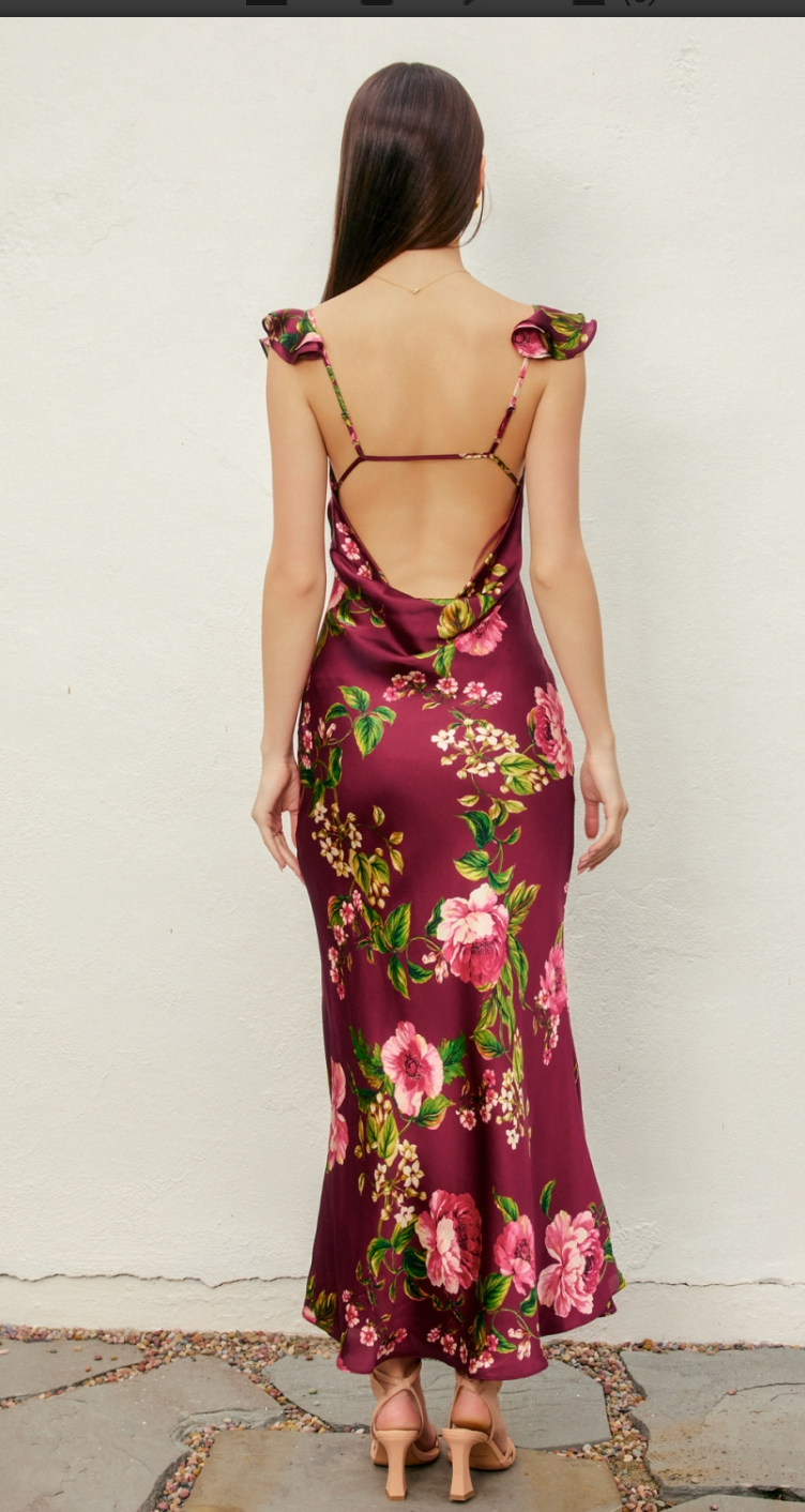 Woman wearing a floral dress with a white background