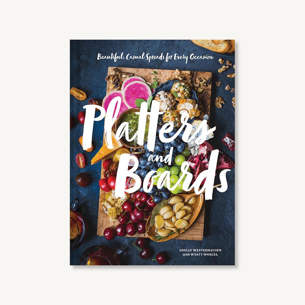 Book cover of 'Platters and Boards' with a colorful spread of food on a blue background.