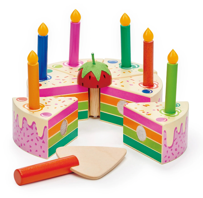Colorful wooden birthday cake toy with candles and a knife on a white background