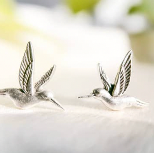 Silver hummingbird earrings on a white background