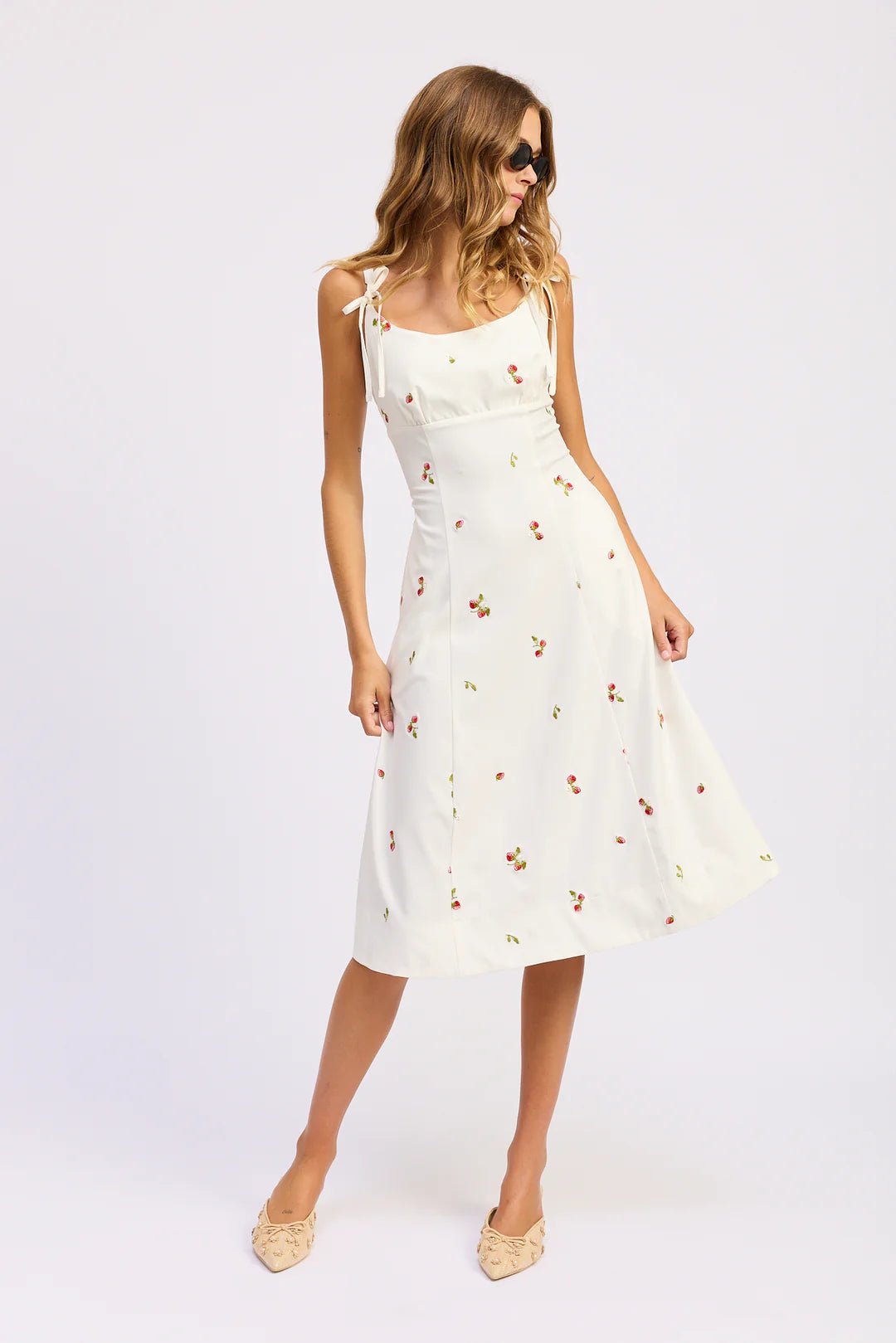 strawberry midi dress Isla Bay Dress, Coral Medium with a gently ruched bodice and bow tie detail Strawberry Garden Midi Dress |
