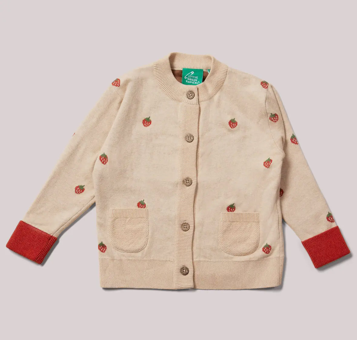 Beige cardigan with red strawberry patterns on a light gray background