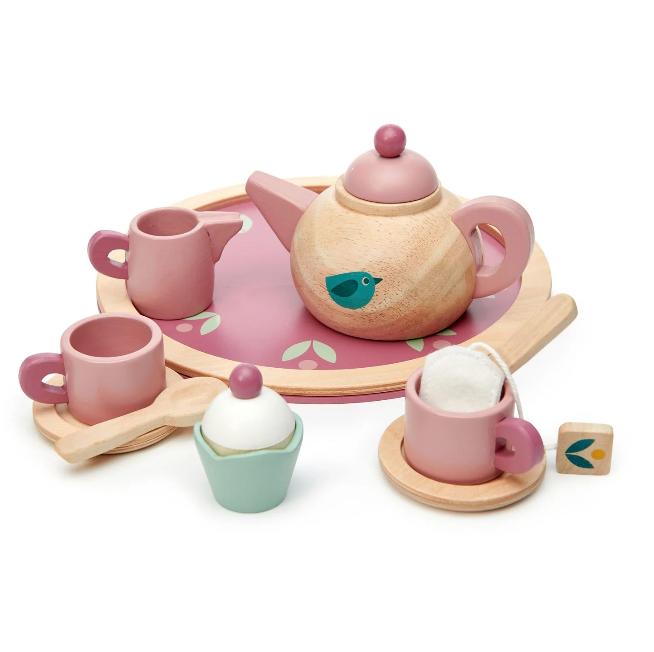 Children's toy tea set with pink teapot, cups, and saucers on a white background