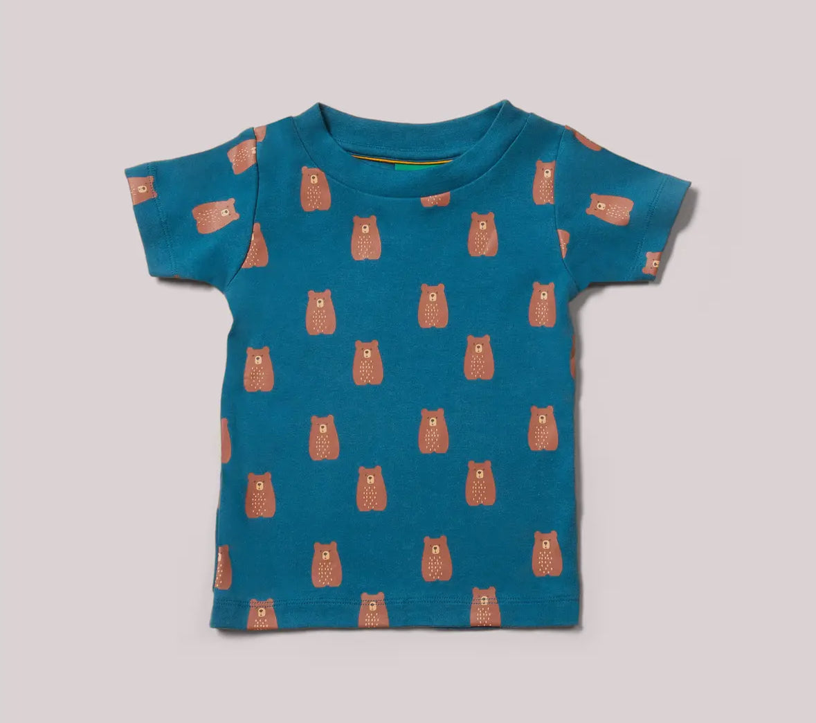 Blue t-shirt with bear pattern on a light gray background