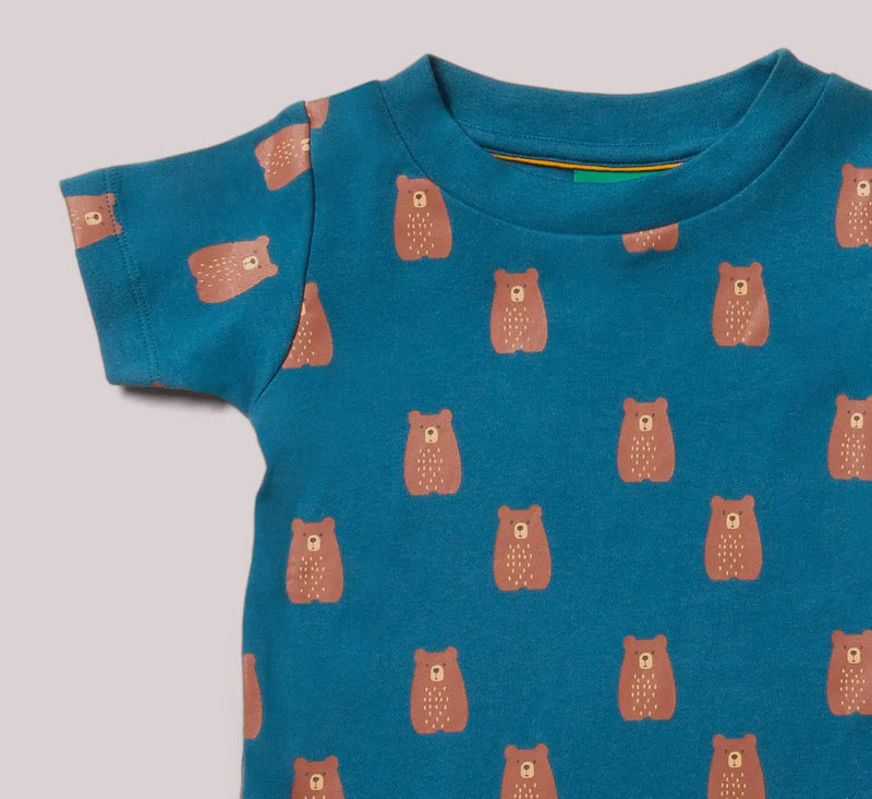 Blue t-shirt with brown bear pattern on a gray background