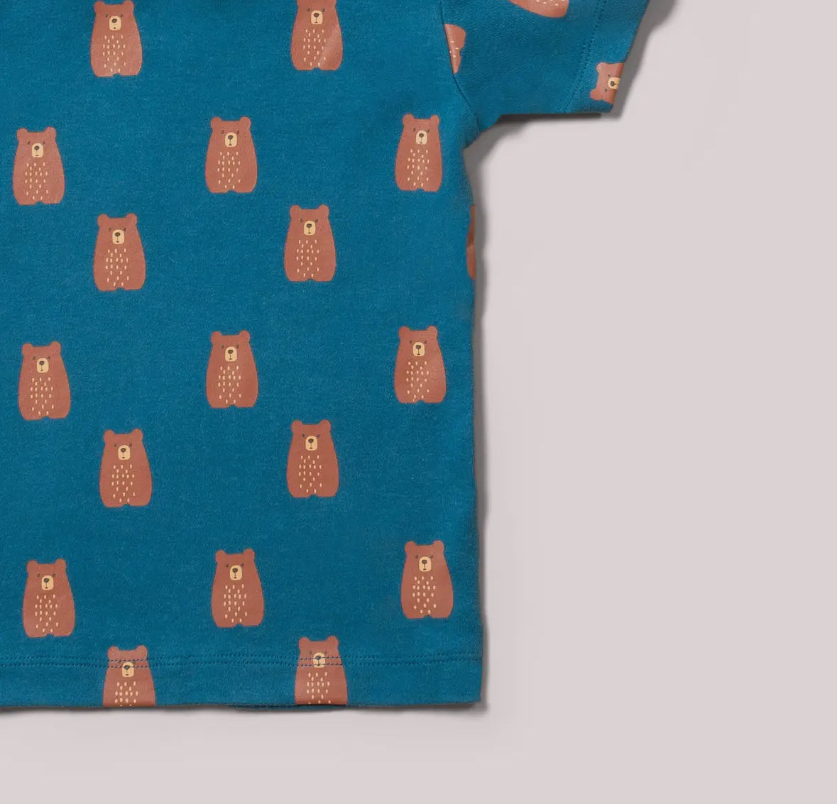 Blue fabric with brown bear pattern on a light gray background