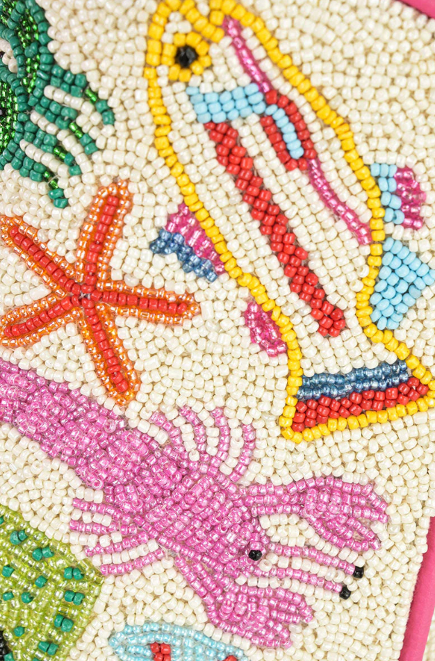 Close-up of a beaded design featuring sea creatures on a white background