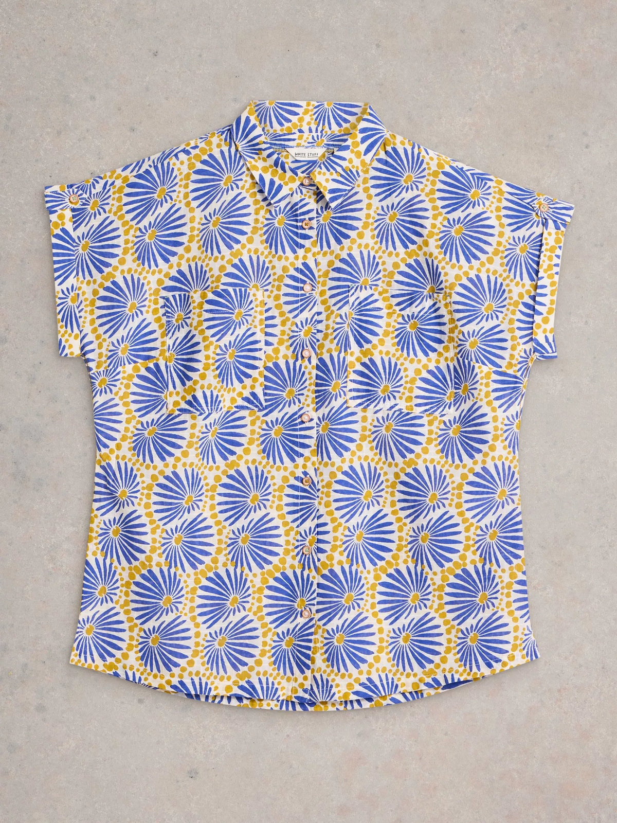 Short-sleeve shirt with blue and yellow geometric pattern on a gray background