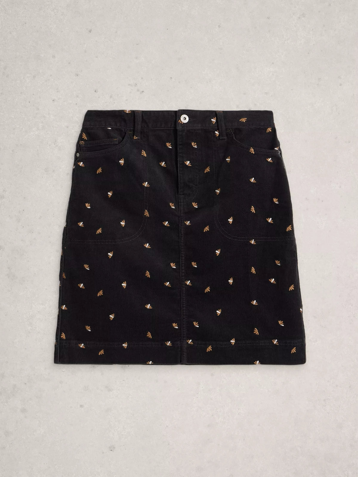 Black skirt with small pattern on a light gray background